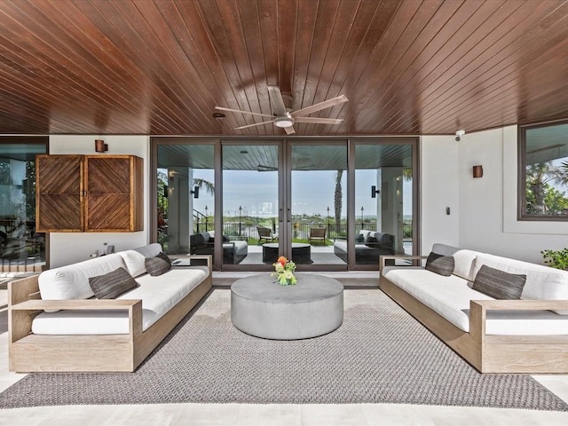 living room featuring floor to ceiling windows and wooden ceiling