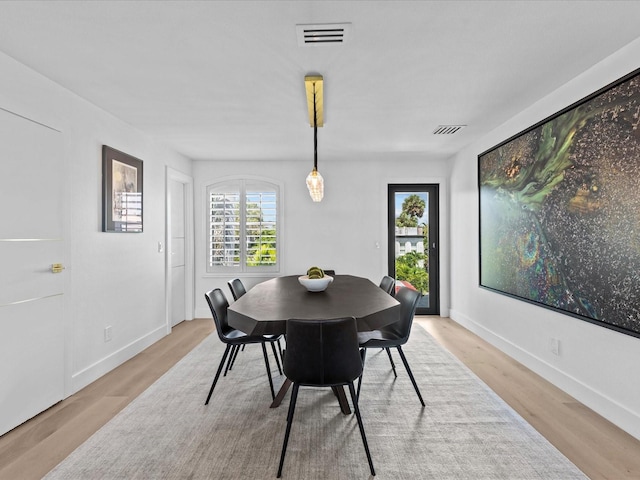 dining space featuring light hardwood / wood-style flooring