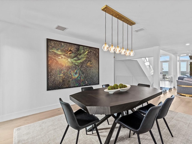 dining area with light wood-type flooring