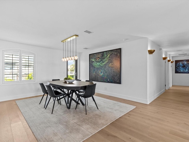 dining area featuring light wood-type flooring