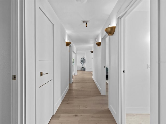 hallway featuring light hardwood / wood-style floors