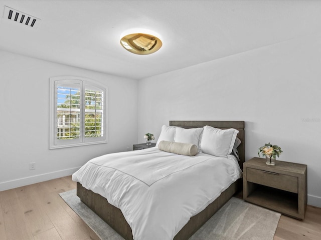 bedroom with light hardwood / wood-style floors