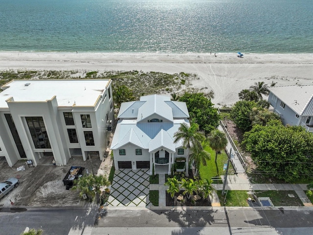 bird's eye view with a water view and a beach view