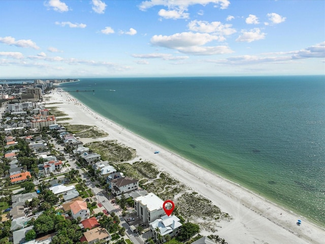 bird's eye view featuring a view of the beach and a water view