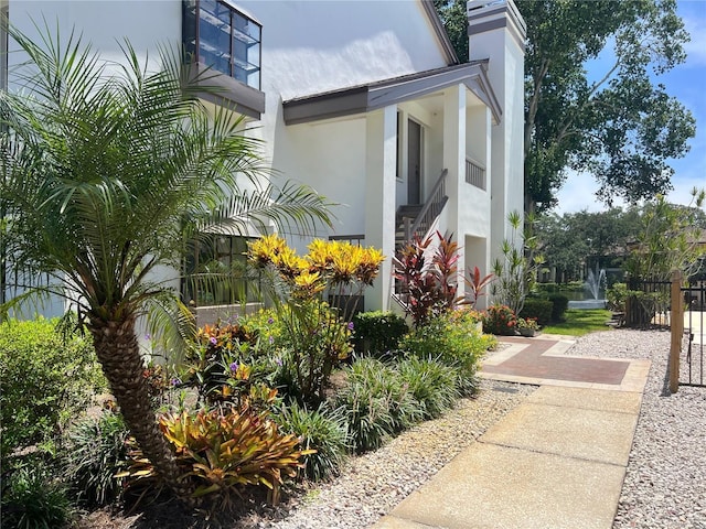 view of side of property with stucco siding