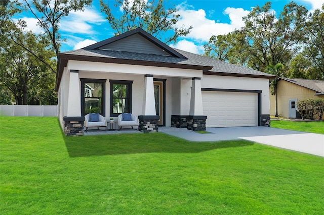 view of front facade featuring a garage and a front lawn