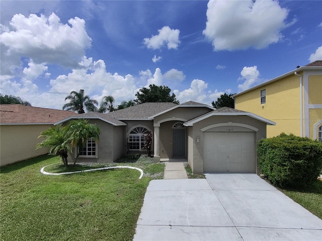 view of front of house featuring a garage and a front yard