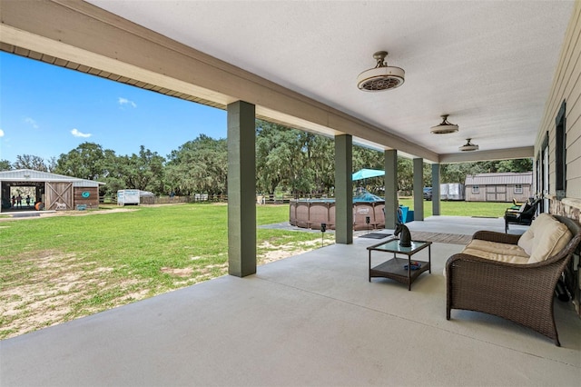 view of patio featuring an outdoor living space and a swimming pool