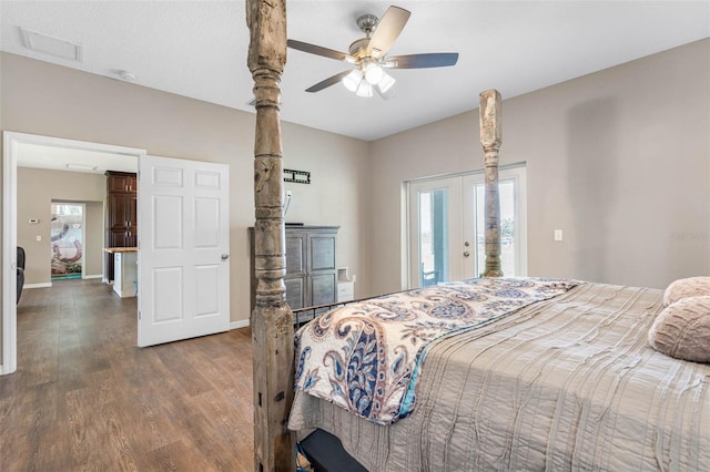 bedroom with multiple windows, dark hardwood / wood-style floors, ceiling fan, and french doors