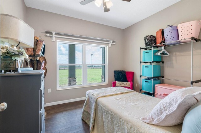 bedroom featuring ceiling fan and dark hardwood / wood-style floors