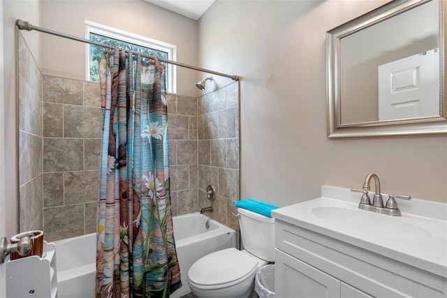 full bath with shower / tub combo, vanity, and toilet