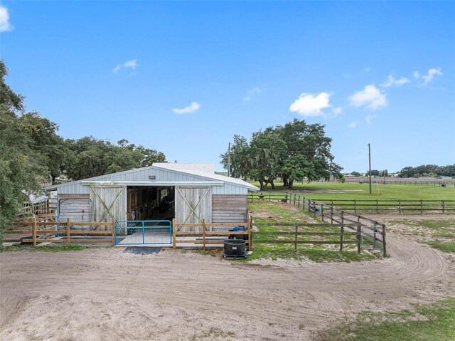 view of outbuilding featuring a rural view