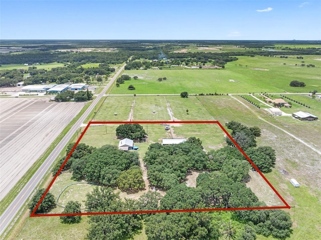 birds eye view of property featuring a rural view