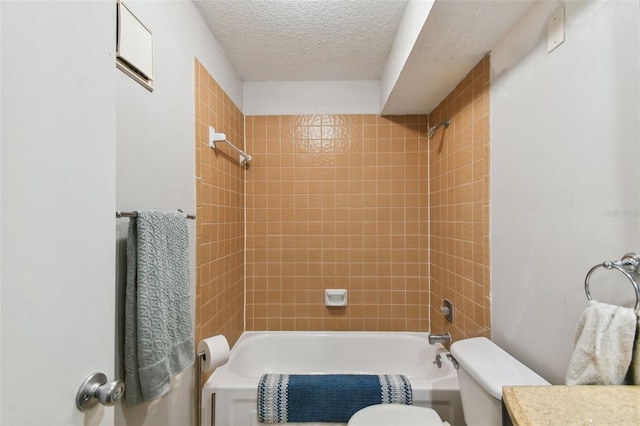 bathroom with shower / bath combination, a textured ceiling, and toilet