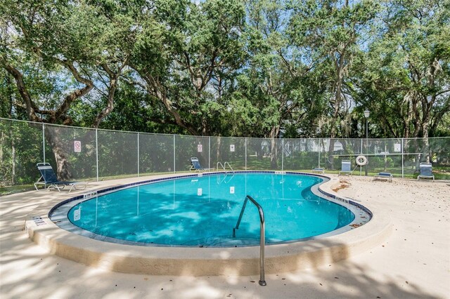 view of swimming pool featuring a patio area