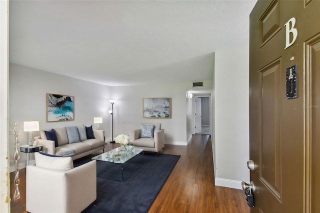 living room featuring dark wood-type flooring