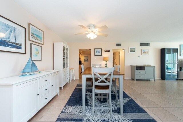 dining room featuring ceiling fan and light tile patterned flooring