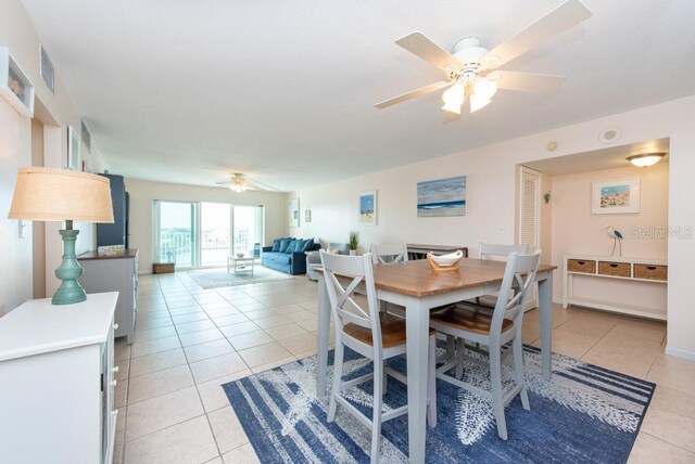 dining room featuring ceiling fan and light tile patterned floors