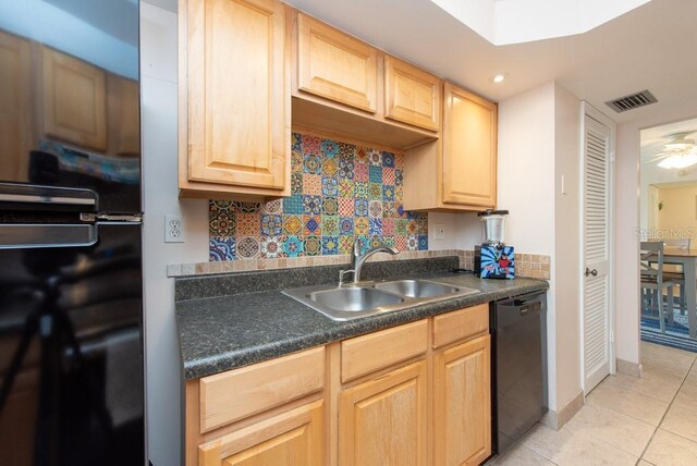 kitchen with black appliances, sink, ceiling fan, light tile patterned floors, and tasteful backsplash