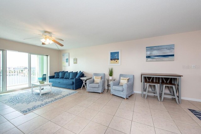 tiled living room featuring ceiling fan