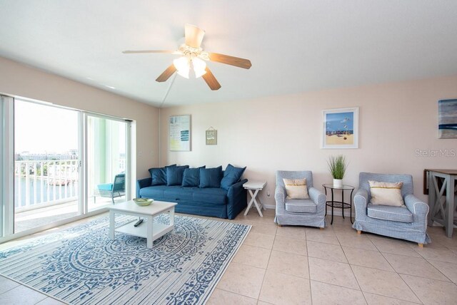 tiled living room with ceiling fan