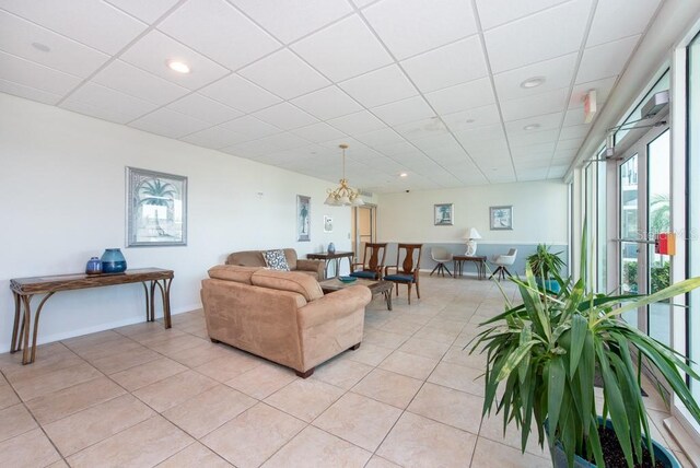 living room featuring light tile patterned floors and a chandelier