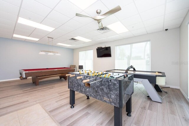 recreation room with a drop ceiling, pool table, and light hardwood / wood-style flooring