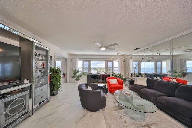 living room featuring crown molding, a water view, ceiling fan, and a textured ceiling