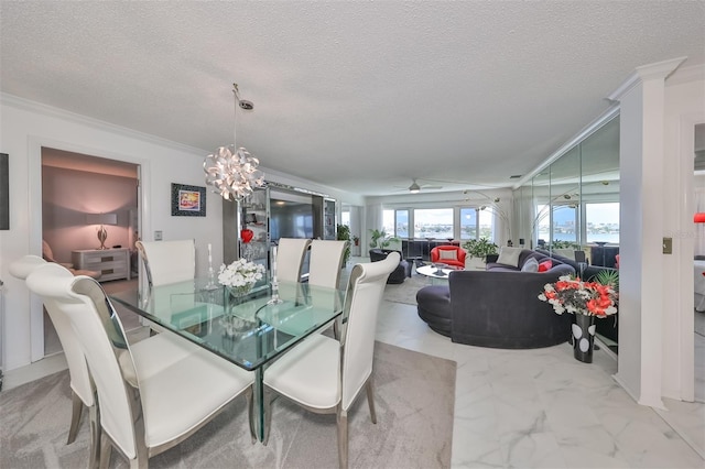 dining area featuring ornamental molding, a chandelier, and a textured ceiling