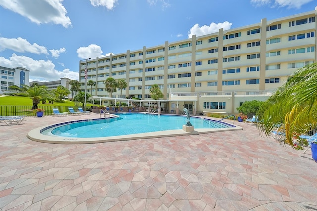 view of swimming pool with a patio area