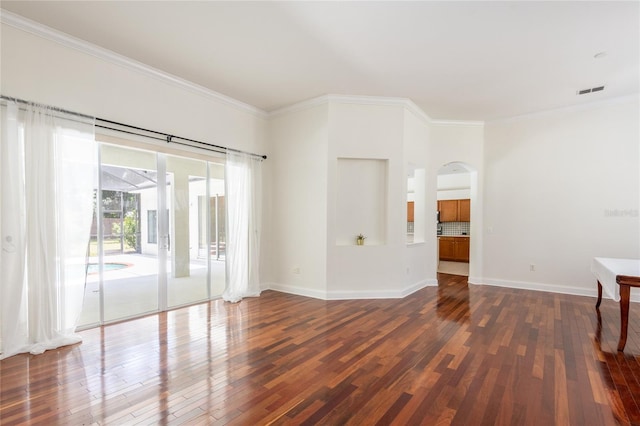 unfurnished room featuring hardwood / wood-style flooring and ornamental molding