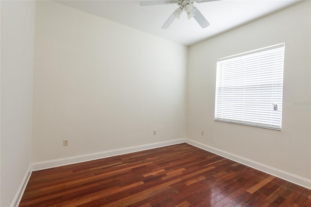 empty room with dark wood-type flooring and ceiling fan