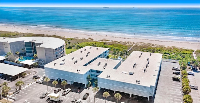 birds eye view of property featuring a water view and a view of the beach