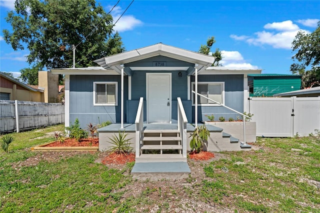 view of front of home featuring a front lawn