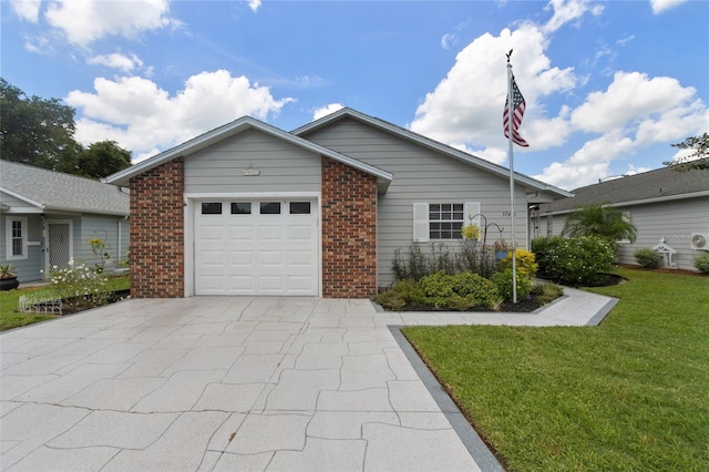 view of front of property with a garage and a front lawn