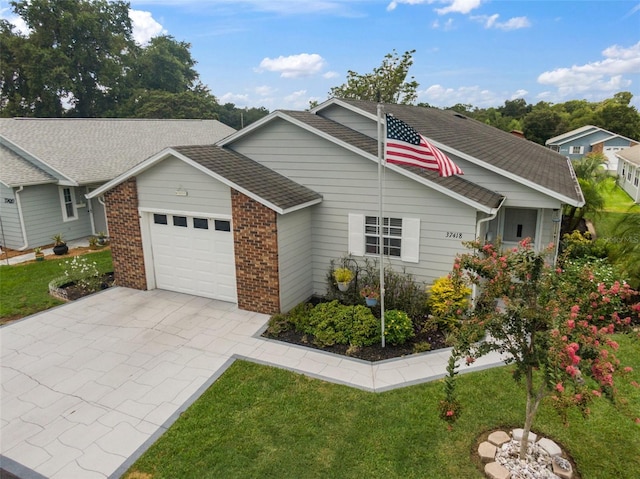 view of front of home with a garage and a front yard