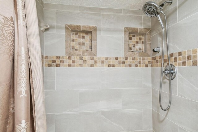 bathroom with a shower with shower curtain