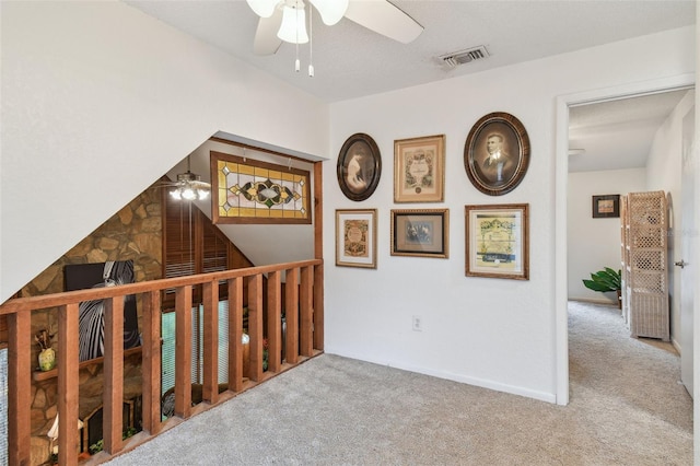 interior space with carpet and a textured ceiling