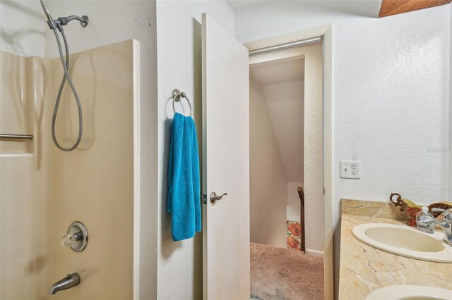 bathroom with vanity and  shower combination