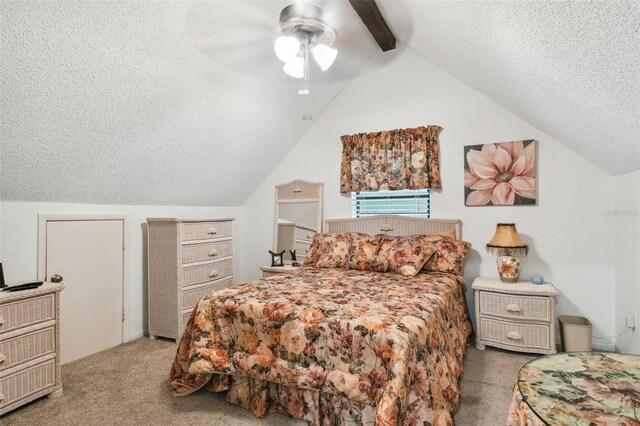 carpeted bedroom featuring a textured ceiling, ceiling fan, and lofted ceiling