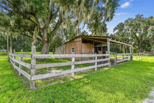 exterior space with an outbuilding and a lawn