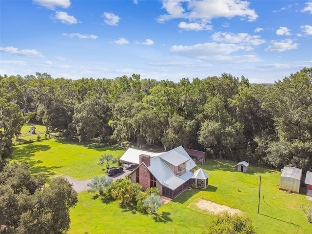 bird's eye view featuring a forest view