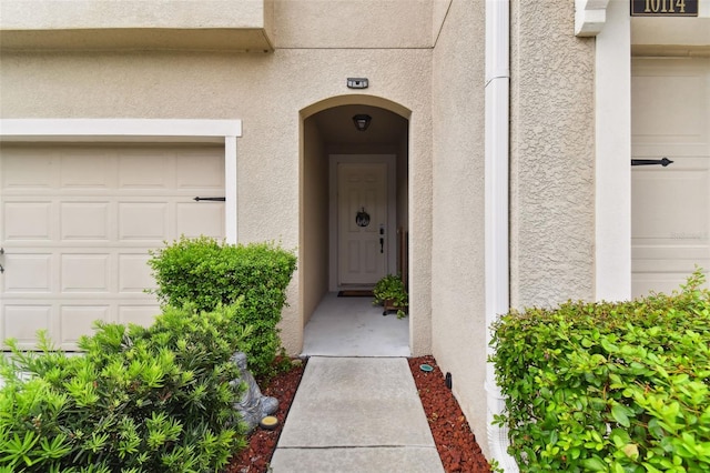 entrance to property featuring a garage