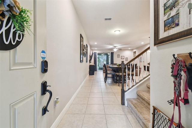 entrance foyer with light tile patterned floors and ceiling fan