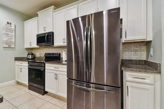 kitchen with white cabinetry, decorative backsplash, stainless steel fridge, and range with electric stovetop