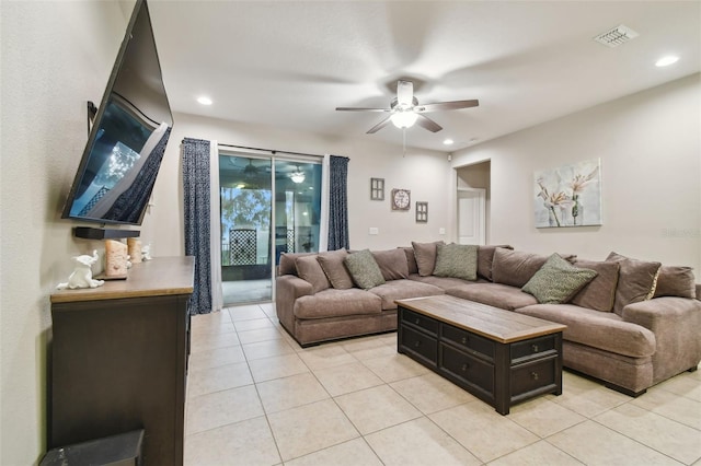 tiled living room with ceiling fan