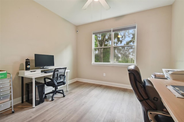 office area with light wood-type flooring and ceiling fan