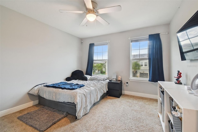 bedroom with light colored carpet and ceiling fan