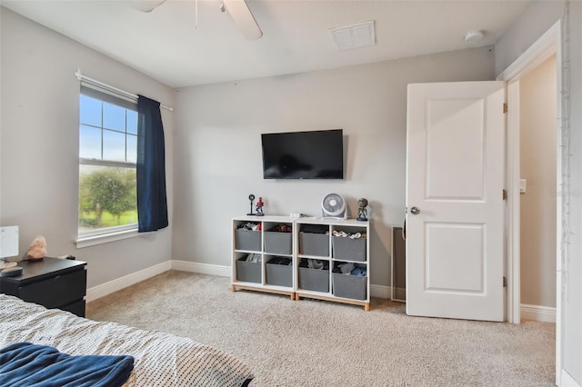 carpeted bedroom with ceiling fan