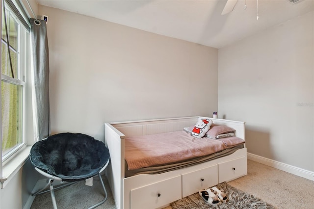 bedroom featuring light carpet and ceiling fan